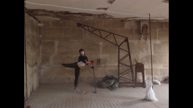 The author of 5, 6, 7, 8, Louise, is standing in an old dusty attic wearing a protective mask. She is doing a ballet move called an attitude in arabesque, and she is holding a broom. There is an old trash bag full of plaster nearby and a weird crane thing overhead.