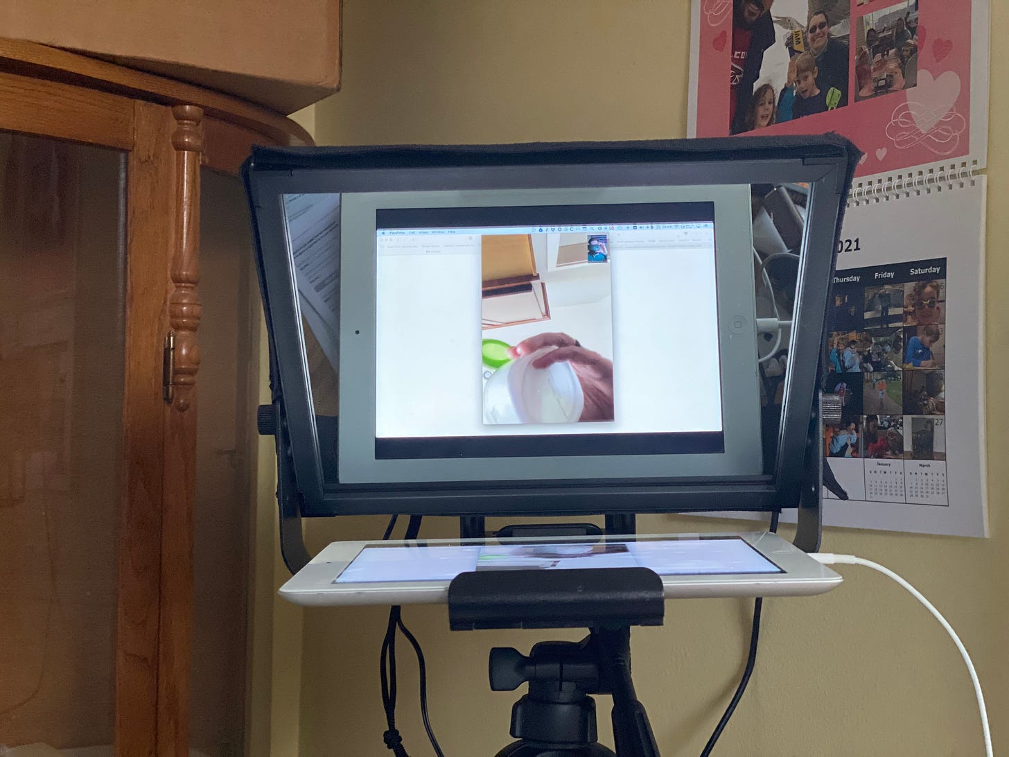 An iPad mounted in the teleprompter frame