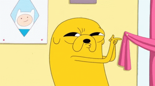 A gif of a scene from Adventure Time of Jake the dog doing finger guns and saying 'Pew'