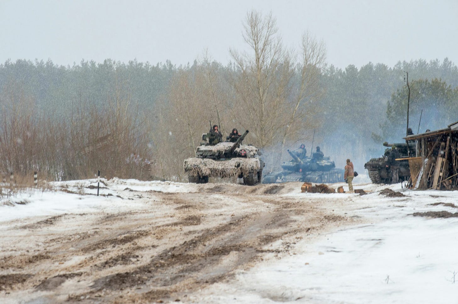 Ukrainian Military Forces servicemen of the 92nd mechanized brigade use tanks, self-propelled guns and other armored vehicles to conduct live-fire exercises near the town of Chuguev, in the Kharkiv region, on Feb. 10, 2022. Credit: Sergey Bobok/AFP via Getty Images