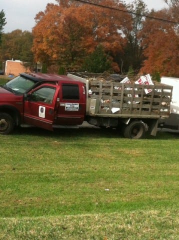 A truck collecting anti-Question 7 signs