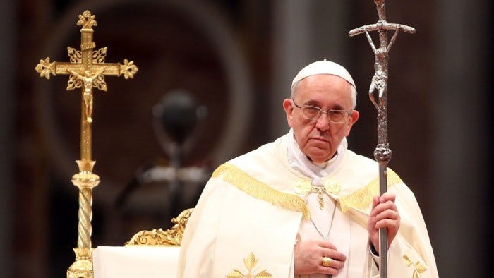 Pope holding crucifix