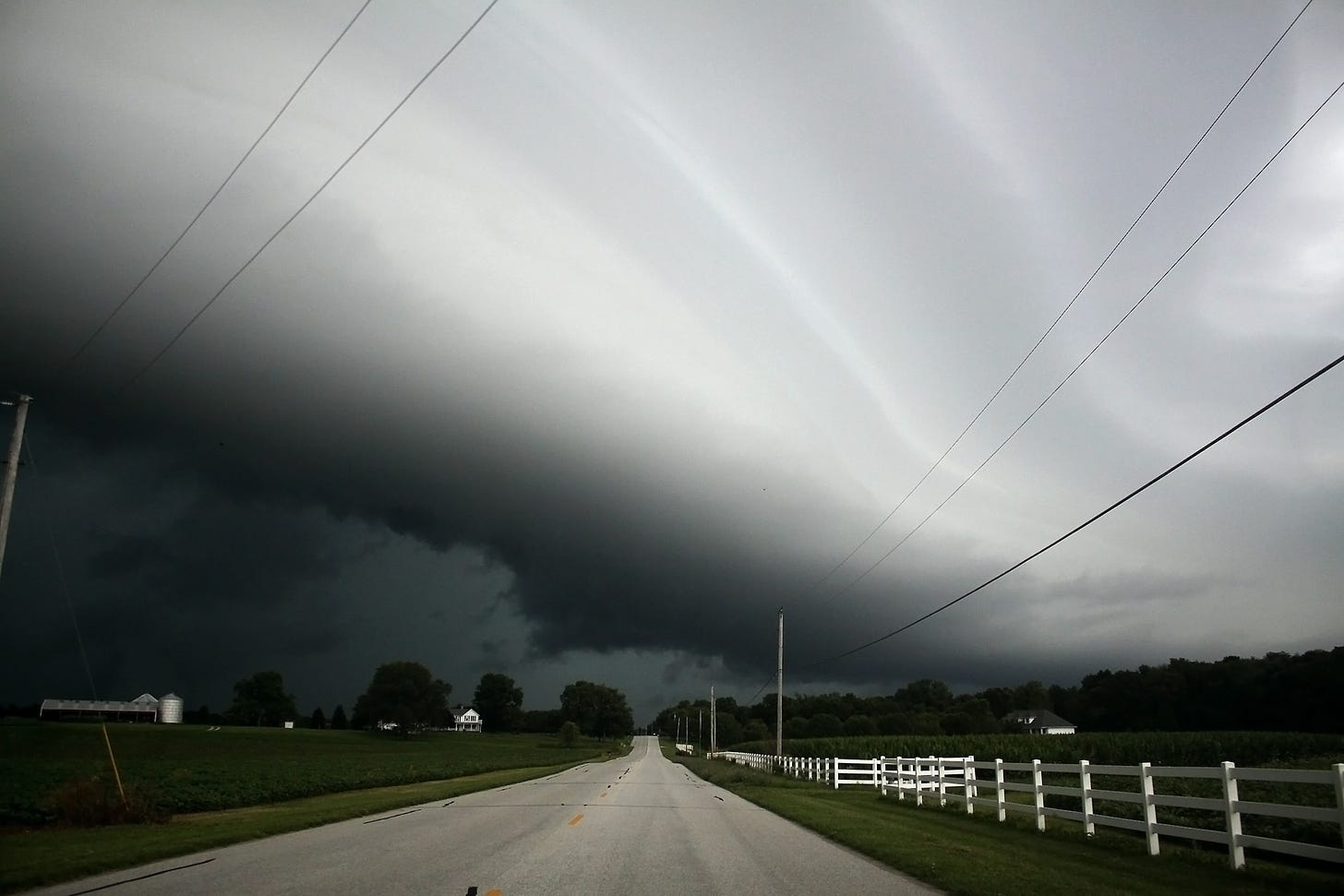 A massive shelf clouds rolls across Henry County, ushering in late summer thunderstorms. The darker clouds, which can be seen below the main cloud, occasionally threatened to swirl into funnel clouds, but eventually dissipated.