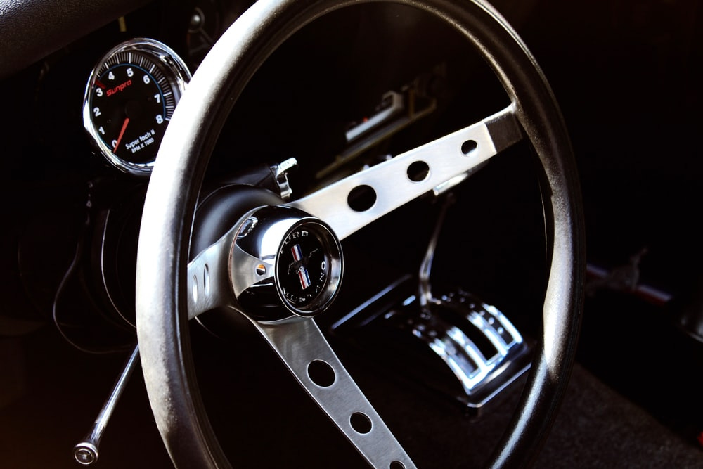 closeup photography of vehicle steering wheel