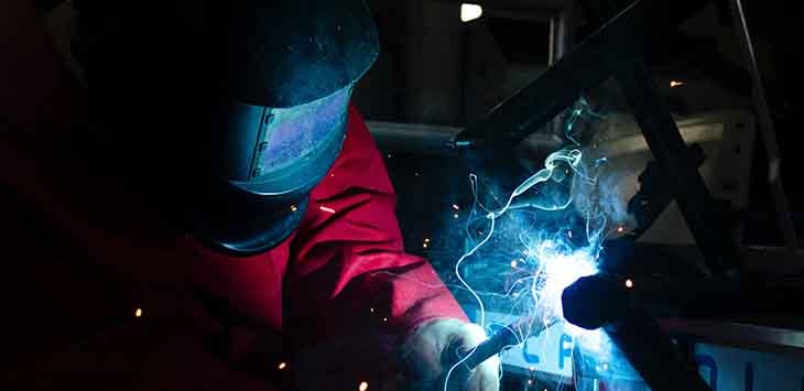 Photo of a man welding