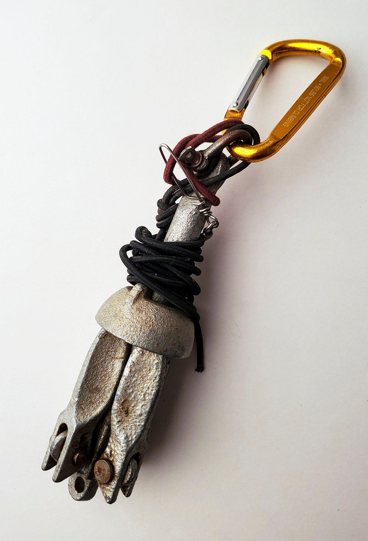 Folding anchor with carabiner