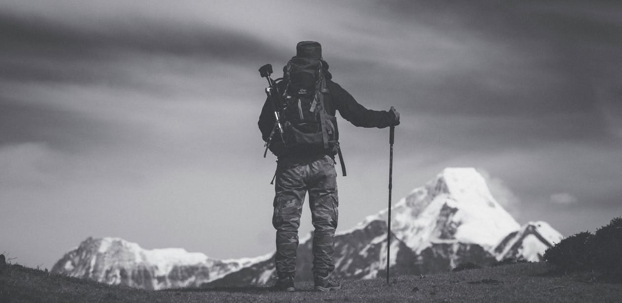 Free Grayscale Photo of Man Standing on Ground Stock Photo