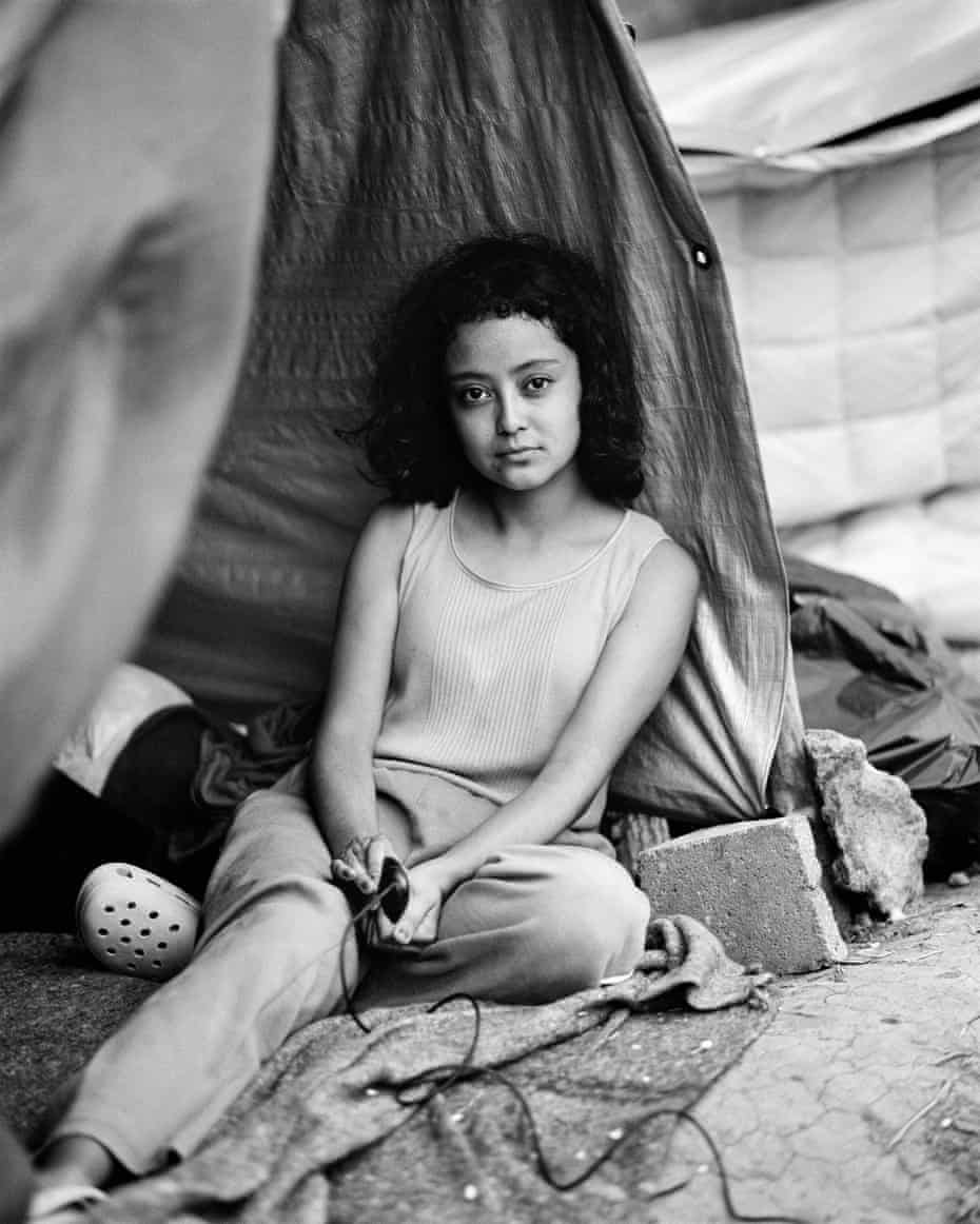 Controlling the narrative … Stephanie Solano uses a cable to take a self-portrait on the Mexican side of the US border.