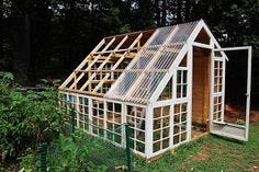 This contains an image of: Custom Backyard Greenhouse with Recycled Windows