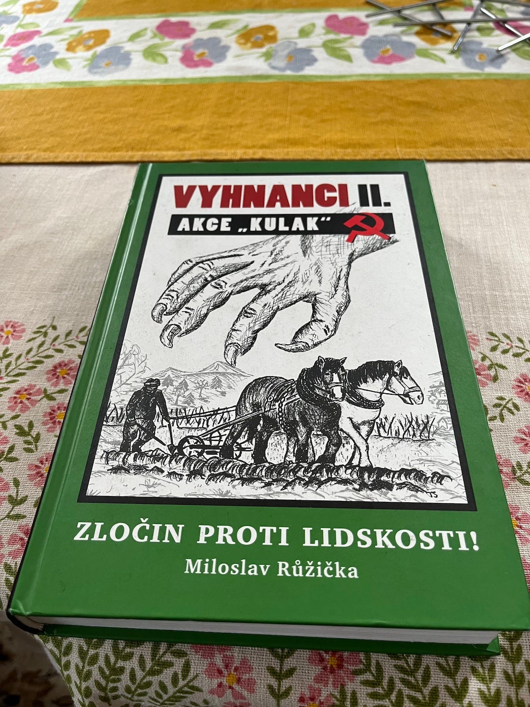 A cover of a book called crimes against humanity about communist rule in the czech republic