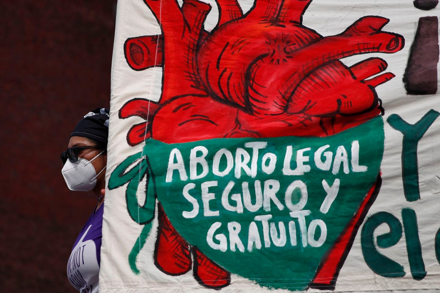 A woman held a banner reading, in Spanish, "Legal, safe, and free abortion, legalize and decriminalize abortion now, for the independence and autonomy of our bodies," as abortion-rights protesters demonstrated in front of the National Congress on the "Day for Decriminalization of Abortion in Latin America and the Caribbean," in Mexico City in September 2020.
