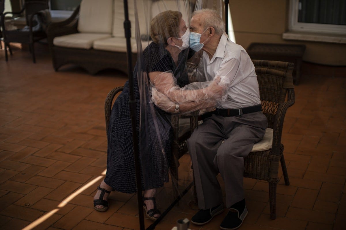 Agustina Cañamero, 81, hugs and kisses her husband Pascual Pérez, 84, through a plastic film screen to avoid contracting the coronavirus at a nursing home in Barcelona, Spain, June 22, 2020. Even when it comes wrapped in plastic, a hug can convey tenderness and relief, love and devotion. The fear that gripped Agustina Cañamero during the 102 days she and her 84-year-old husband spent physically separated during Spain's coronavirus outbreak dissolved the moment the couple embraced through a screen of plastic film.