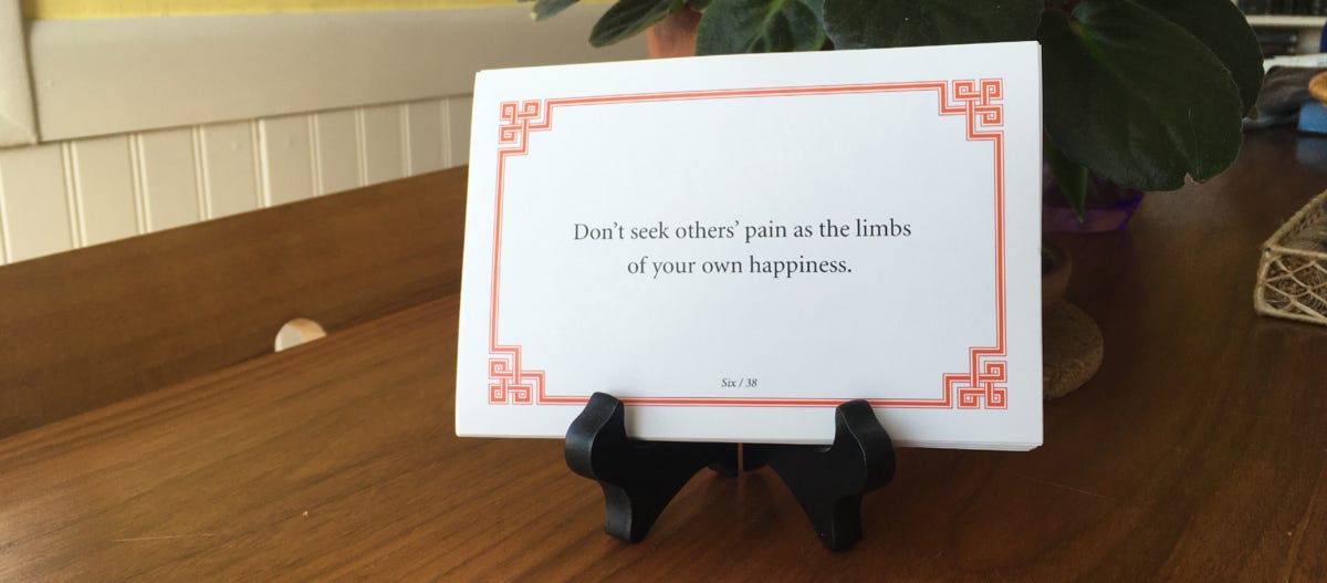 Lojong slogan card reading “Don’t seek others’ pain as the limbs of your own happiness.”