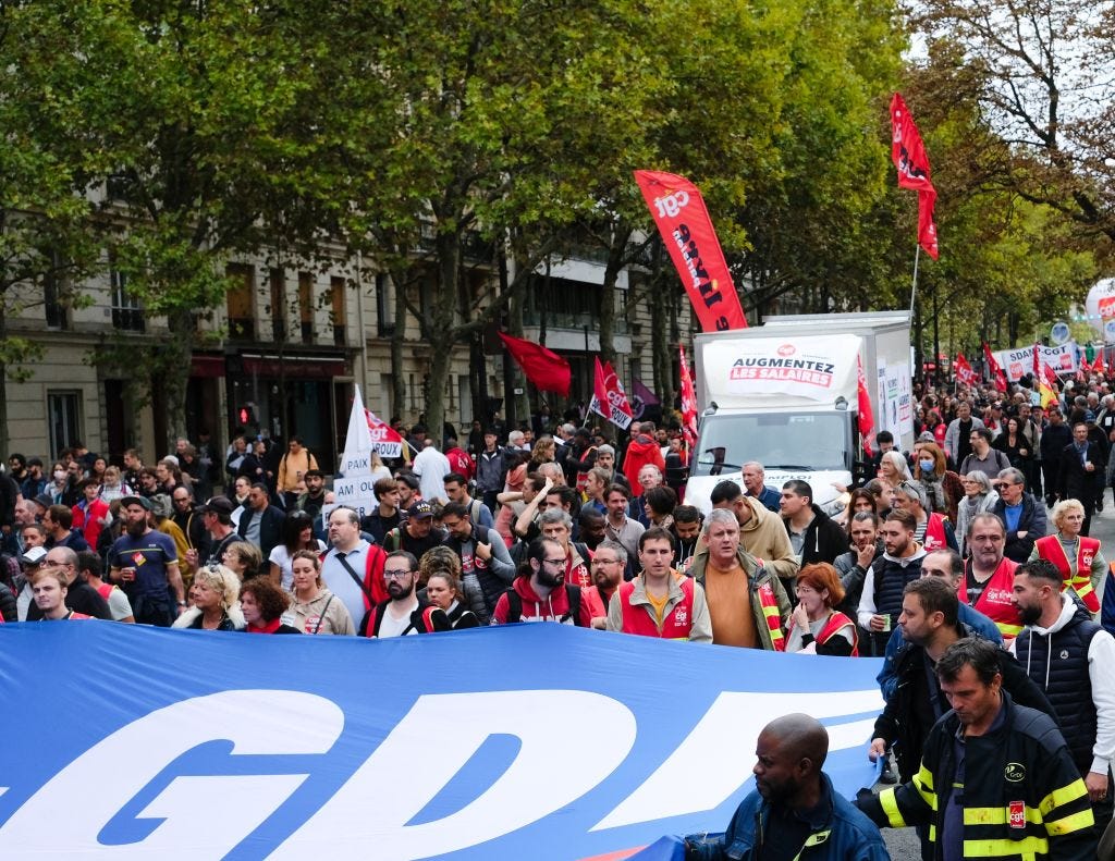 Striking workers marching in Paris on Tuesday (Vincent Koebel/Anadolu Agency via Getty Images)