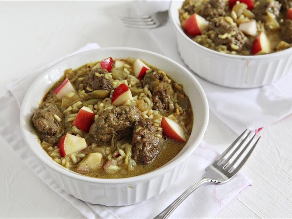 Step 9 of Curried Guinea Meatballs with Escarole and Rice Recipe: Dice the Red Pear (2). Divide rice in two bowls, ladle curried guinea meatballs over rice, and top with diced red pears. Enjoy!