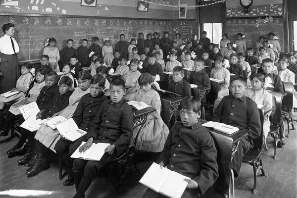 A first- and second-grade class at the Genoa Indian Industrial School in Genoa, Neb., in 1910. The Peabody Museum at Harvard said the school was among the possible locations where hair samples were taken.
