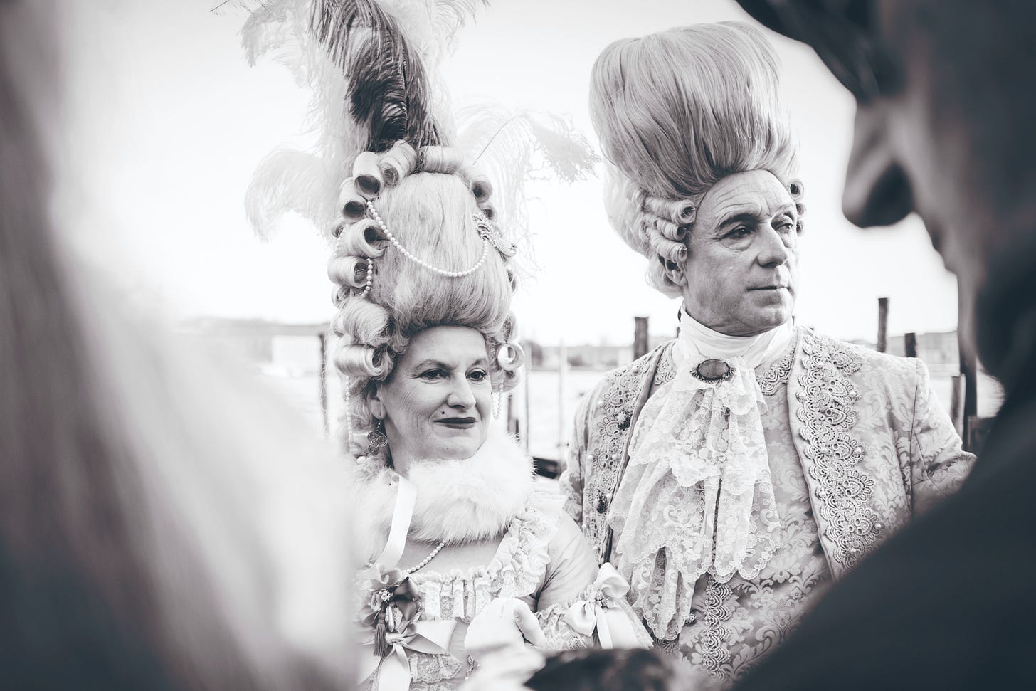 black and white photography of man and woman in costume photo