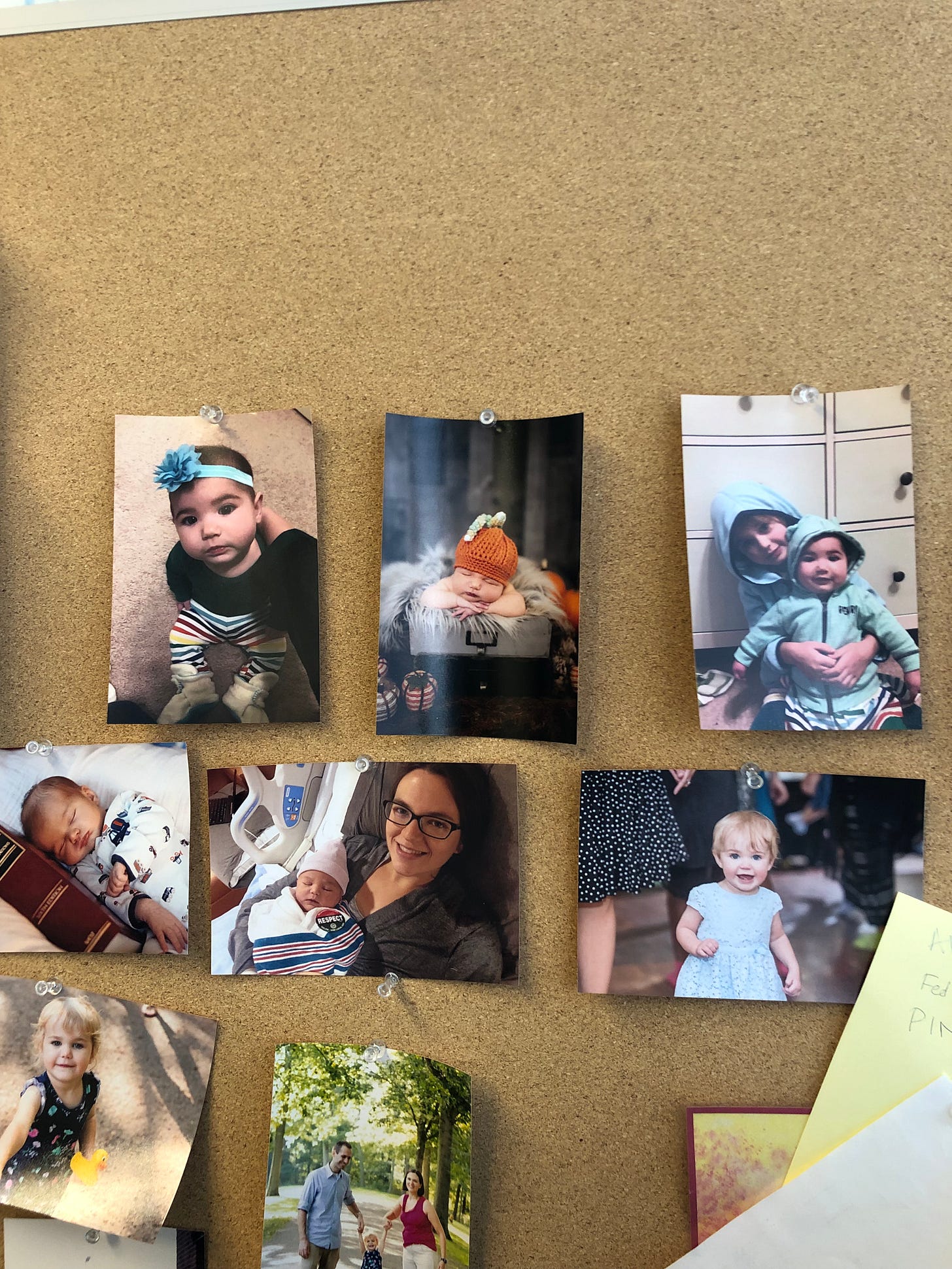 Photo of bulletin board with pictures of babies Photo of bulletin board with pictures of babies