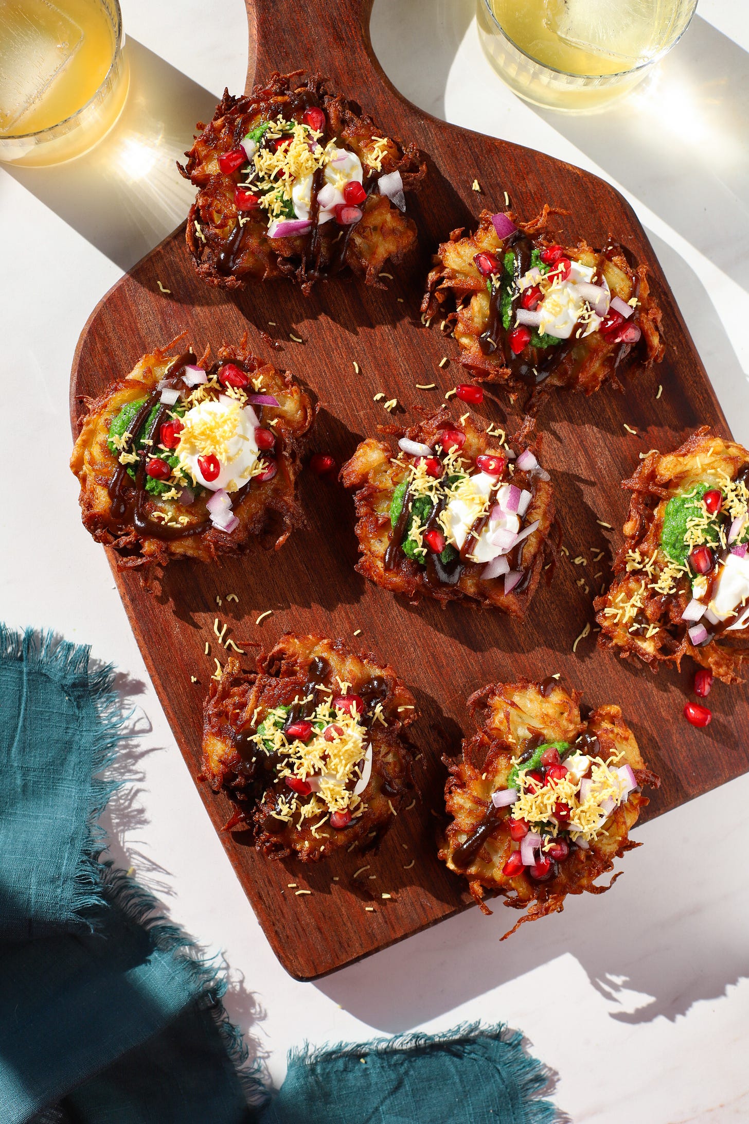 Board with latkes, plus chaat toppings