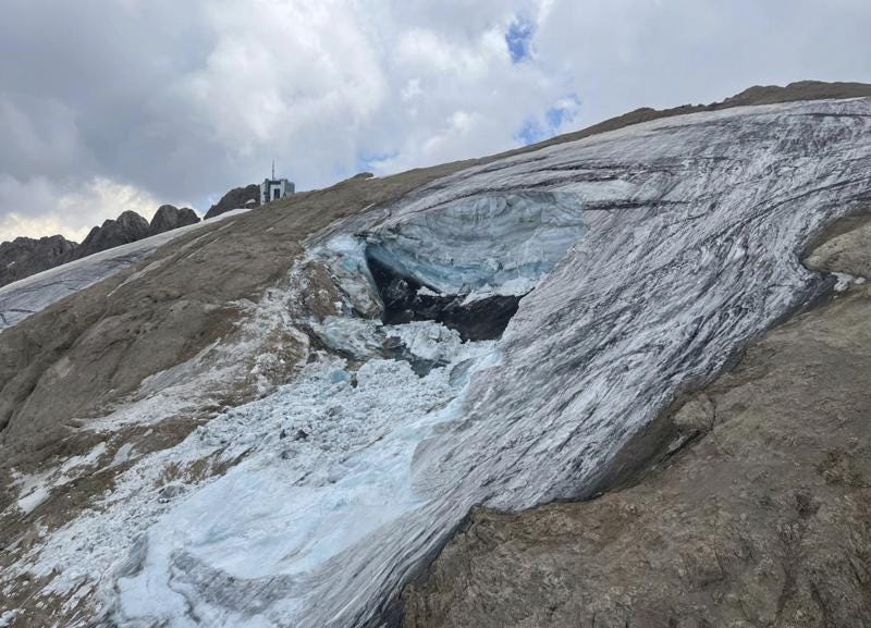 This undated image made available Monday, July 4, 2022, by the press office of the Autonomous Province of Trento shows the glacier in the Marmolada range of Italy's Alps near Trento from which a large chunk has broken loose Sunday, killing at least six hikers and injuring eight others. Drones were being used to spot any more bodies on an Italian Alpine mountainside a day after a huge chunk of a glacier broke loose, sending an avalanche of ice, snow, and rocks onto hikers. Rescuers on Sunday spotted six bodies and said nine survivors were injured. Attention on Monday was focused on determining how many people who might have been hiking on the Marmolada peak are unaccounted for. Rescuers said conditions downslope from the glacier, which has been melting for decades, were still too unstable to immediately send rescuers and dogs into the area to look for others buried under tons of debris.  (Autonomous Province of Trento via AP)