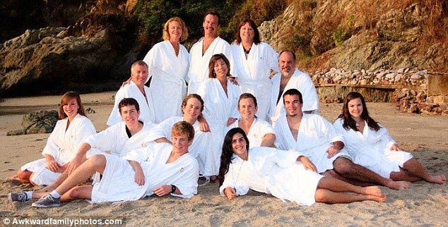 On the beach: This bath robes shot is certainly one the kids might want to avoid appearing on Facebook