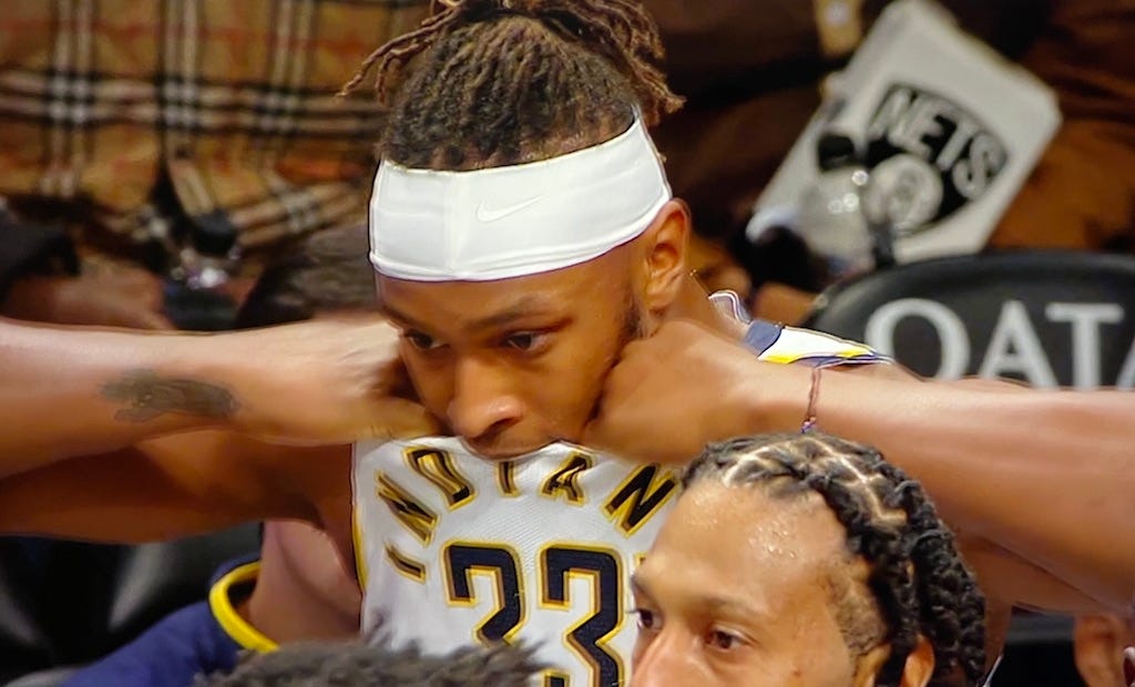 Myles Turner tears at his jersey in frustration Monday night in Brooklyn.