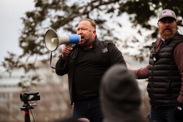 Alex Jones speaking to a crowd of supporters of President Donald J. Trump near the Capitol on Jan. 6, 2021.