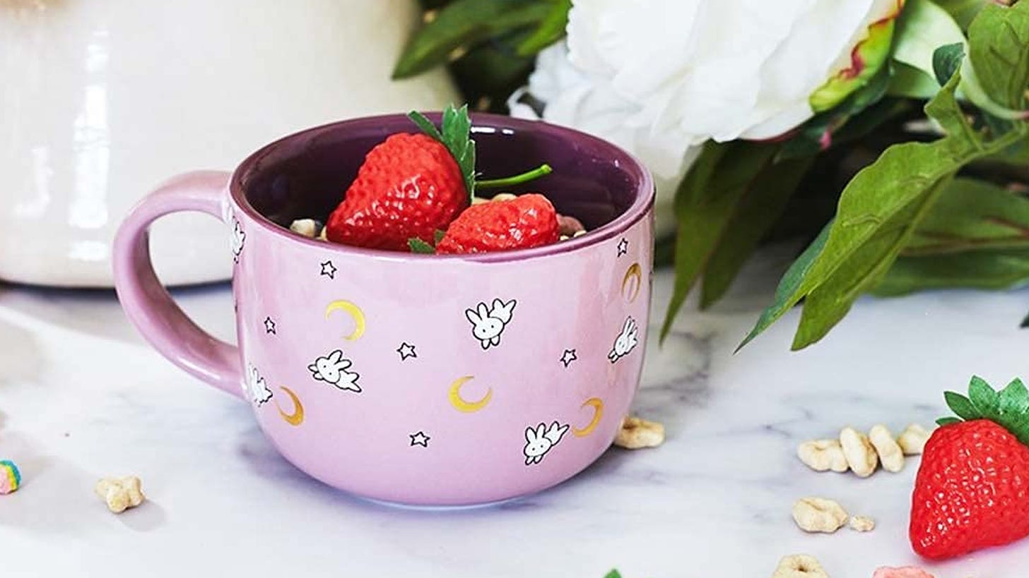 Pink Sailor Moon soup mug with cresecent moon and rabbit icons on it.