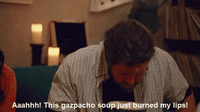 A screenshot from I Think You Should Leave; the Jazz Guy is saying the gazpacho burned his lips