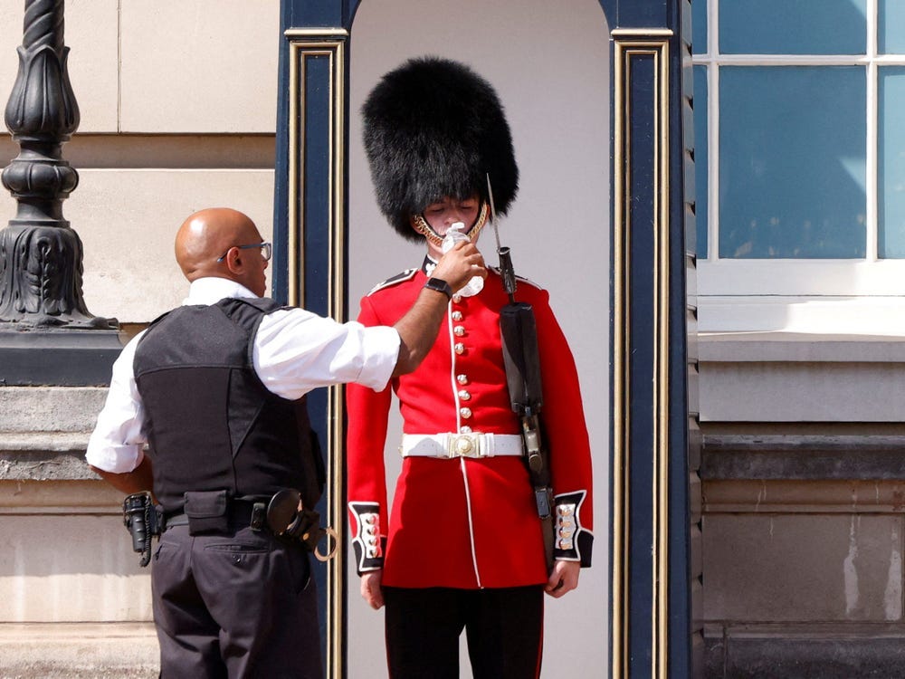 Queen's Guards Working Outside in Traditional Uniforms During Heatwave
