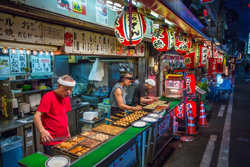 Street vendors selling food: MACH Photos/Shutterstock.com