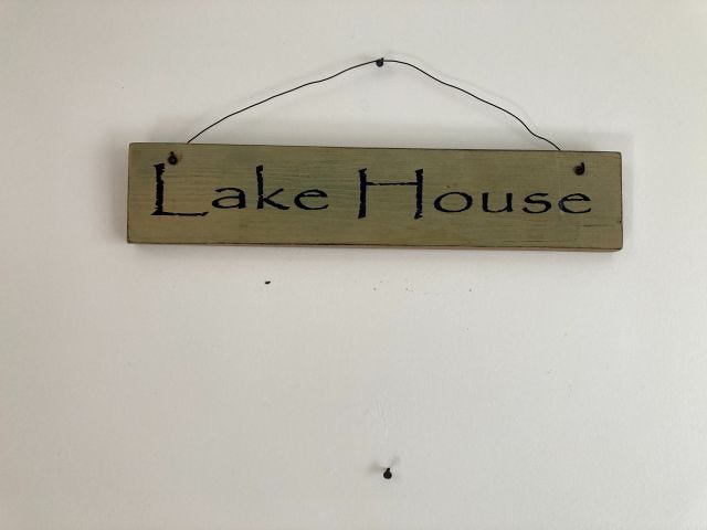 A sign that reads Lake House