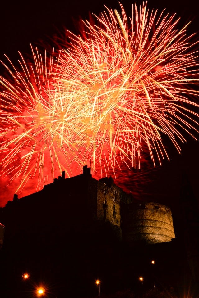 Fireworks exploding over Edinburgh Castle