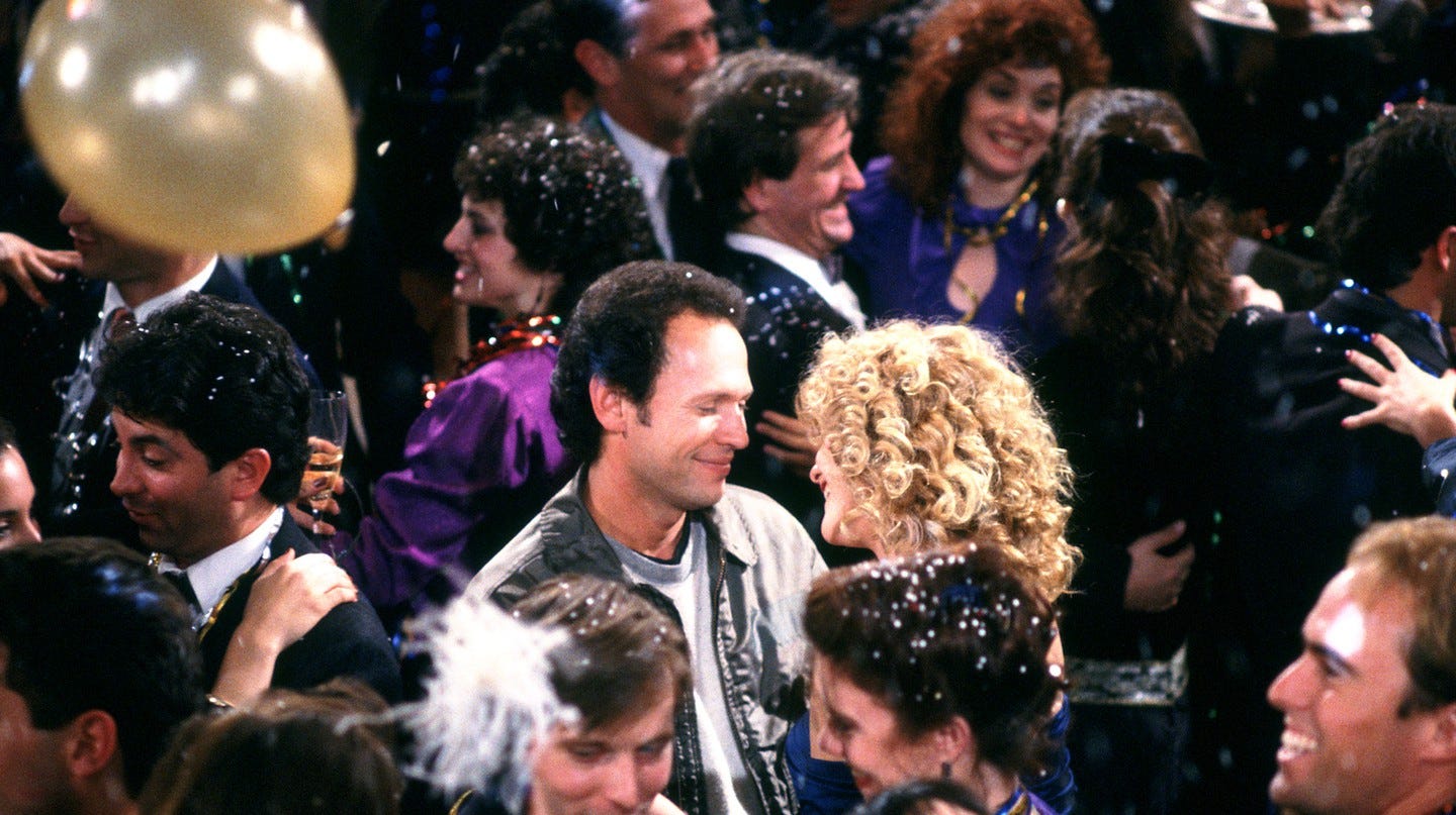 The final scene of When Harry Met Sally, with Billy Crystal and Meg Ryan smiling at each other at a New Year's Eve party