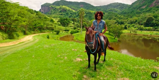 Lenny Kravtiz atop a horse, in his working farm in Brazil.