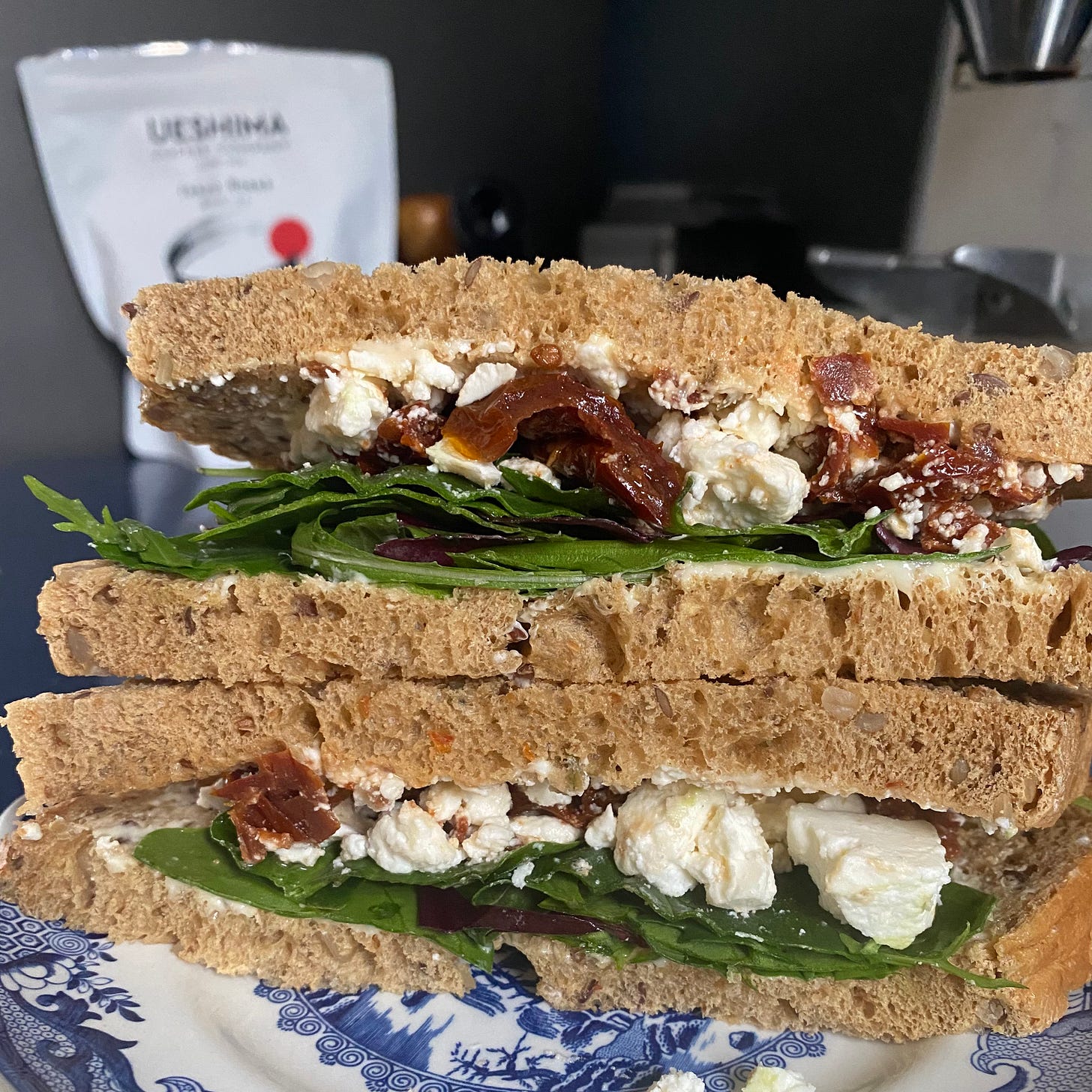 Malted brown bread sandwich filled with sundried tomato and feta