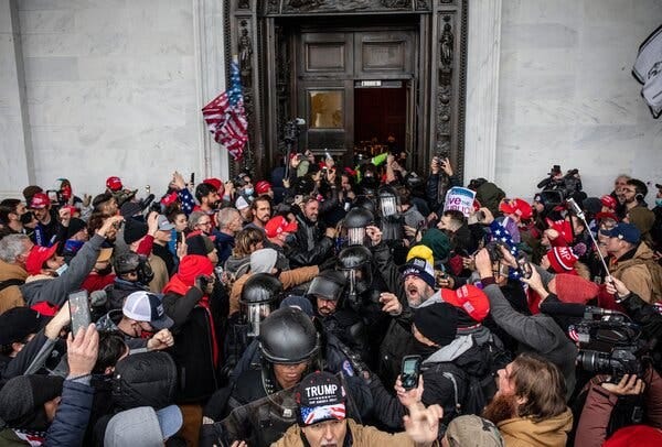 The police forced the crowd out of the Capitol building after facing off in the Rotunda, Jan. 6, 3:40 p.m.