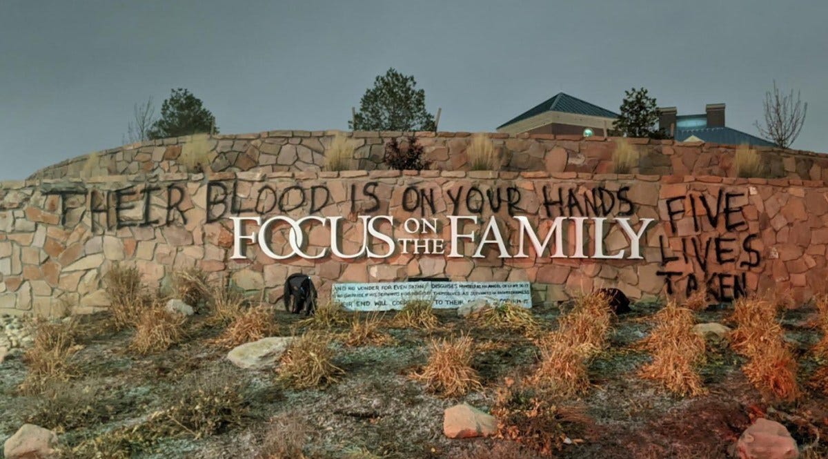 Here's why vandals sprayed graffiti at Focus on the Family headquarters | Graffiti outside Focus on the Family headquarters says, "Their blood is on your hands"
