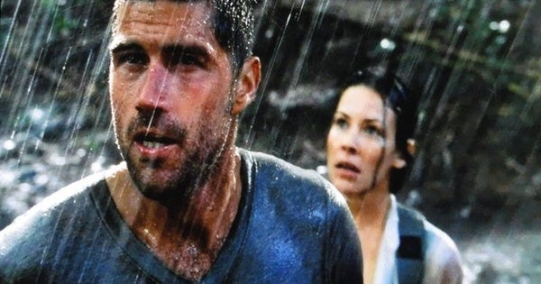 Jack Shephard (Matthew Fox) and Kate Austen (Evangeline Lilly) stand in the rain, looking heroic and determined and wet.