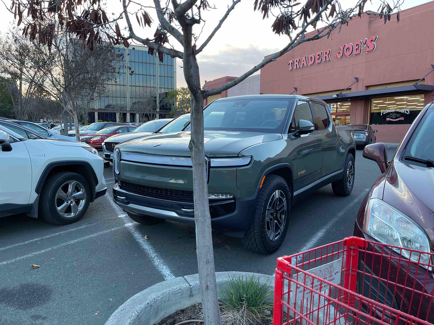 An image taken by the author of a Rivian pickup truck parked in front of a grocery store