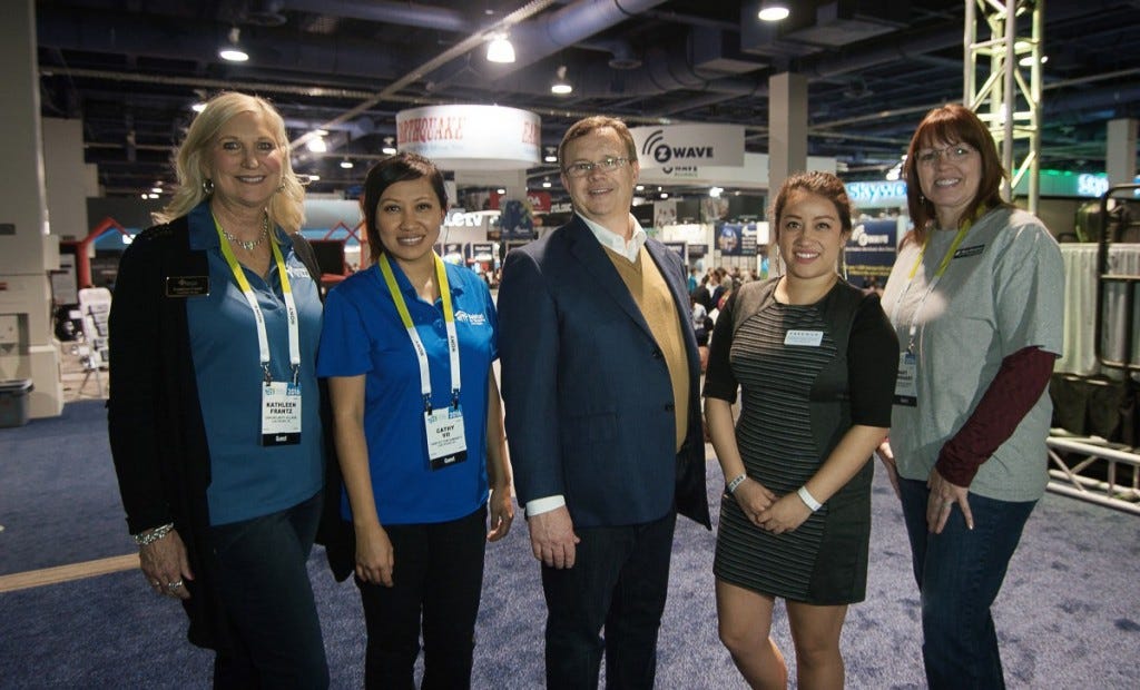 Jeff Chase, center, with representatives of charity partners from Habitat for Humanity, Goodwill, Teachers Exchange and Opportunity Village, courtesy of Freeman