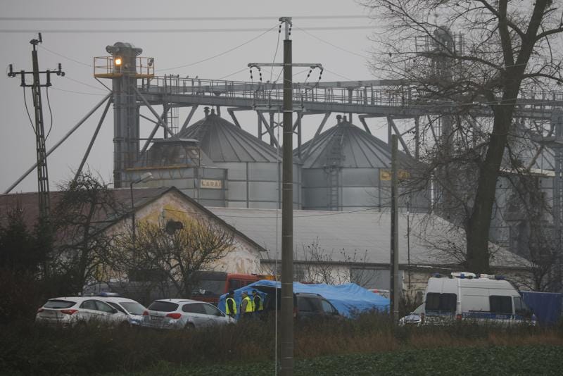 Police officers work outside a grain depot where, according to the Polish government, an explosion of a Russian-made missile killed two people in Przewodow, Poland, Wednesday, Nov. 16, 2022. Poland said Wednesday that a Russian-made missile fell in the country’s east, killing two people, though U.S. President Joe Biden said it was "unlikely” it was fired from Russia. (AP Photo/Michal Dyjuk)