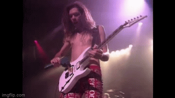 Gif of Paul Gilbert playing with a drill