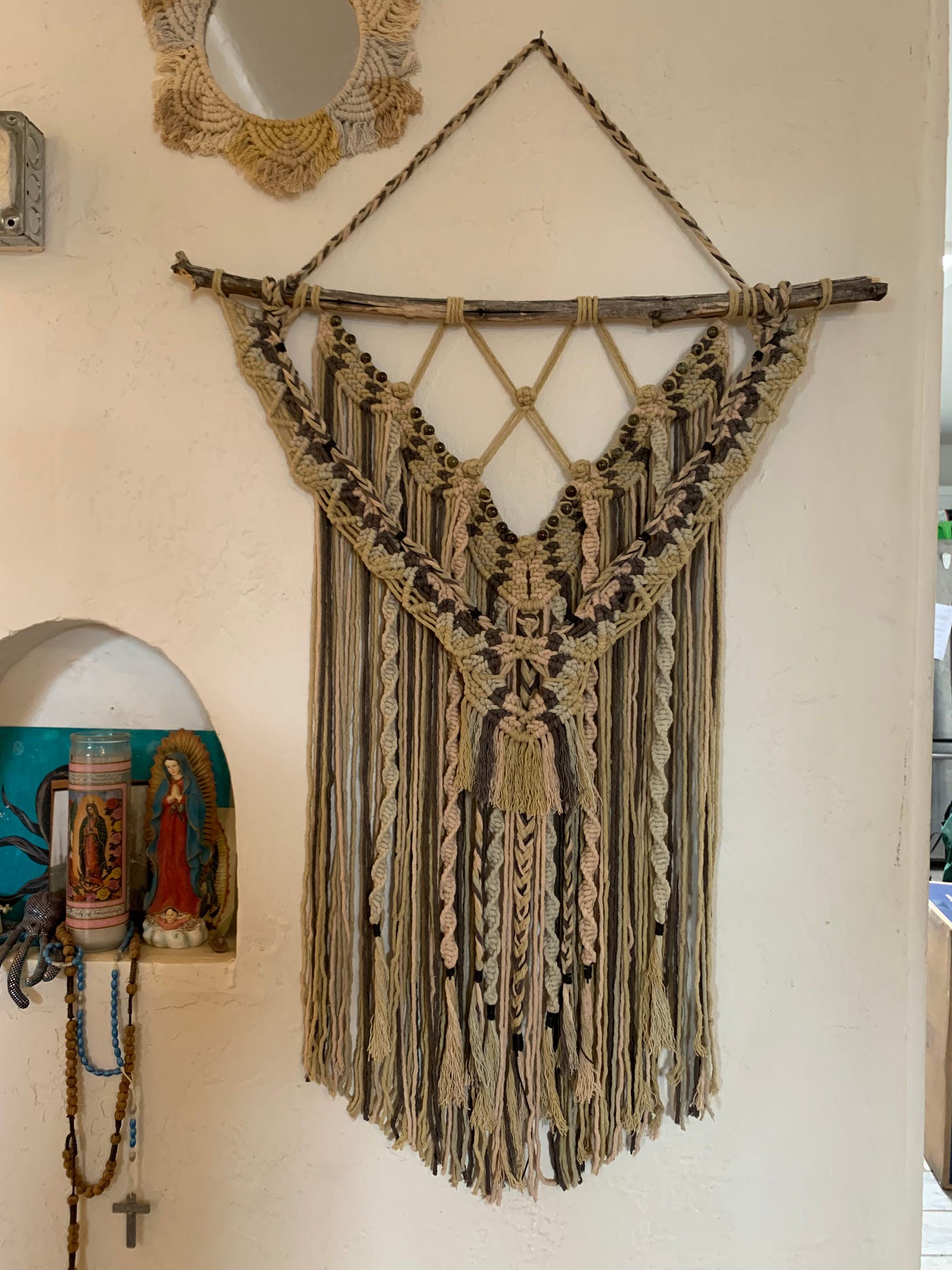 photo of a macrame wall hanging made with naturally dyed rope