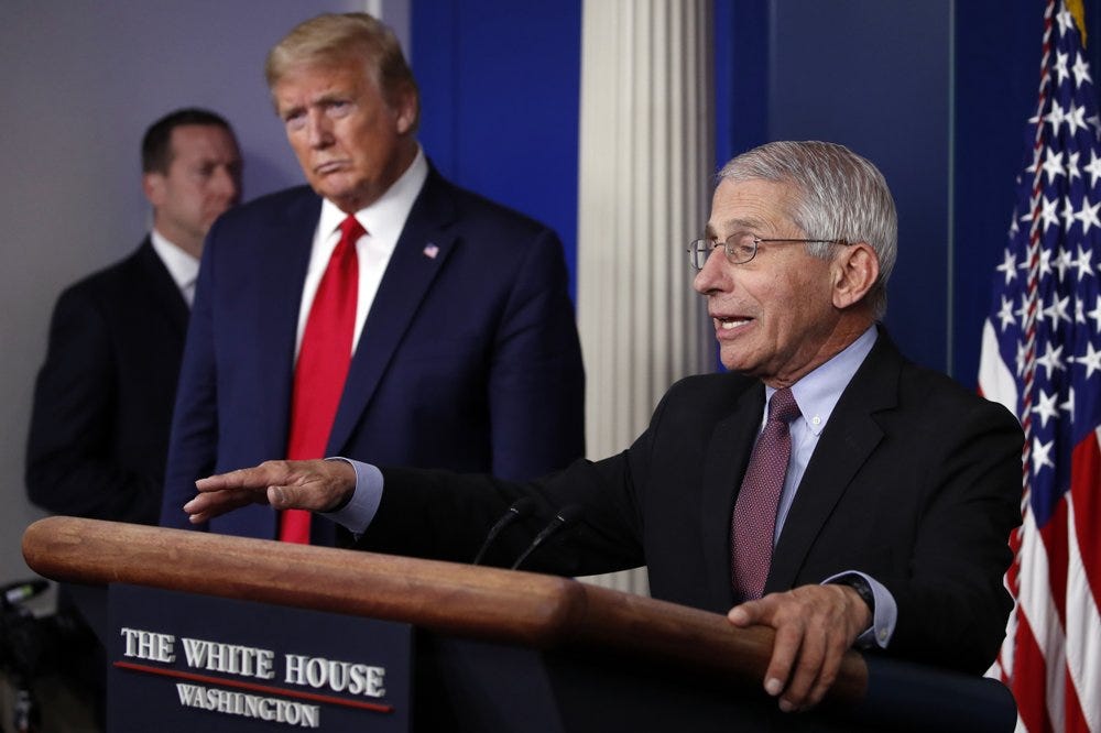President Donald Trump listens as Dr. Anthony Fauci, director of the National Institute of Allergy and Infectious Diseases, speaks about the coronavirus in the James Brady Press Briefing Room of the White House, Wednesday, April 22, 2020, in Washington. (AP Photo/Alex Brandon)