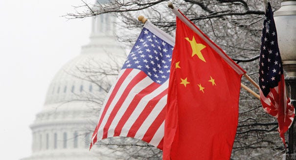The American and Chinese flags are seen. | AP Photo