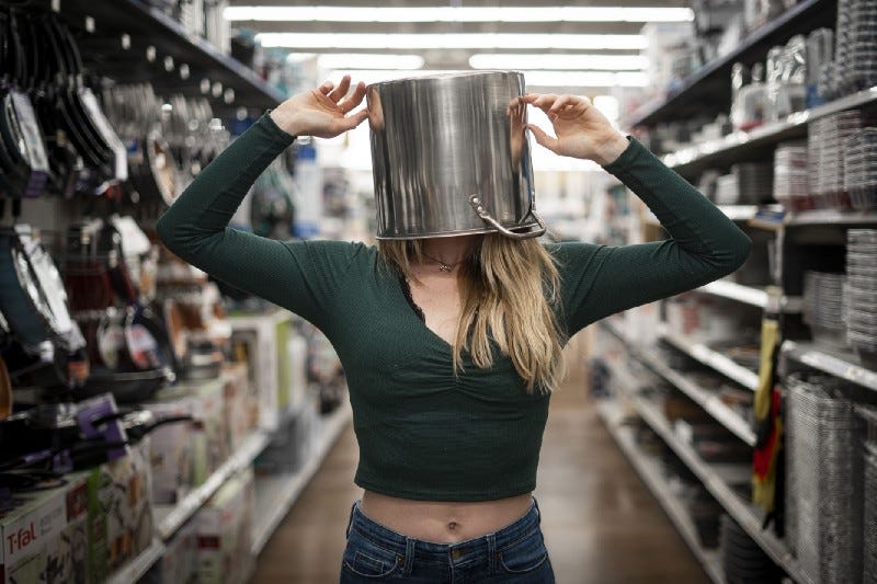 A woman with a bucket on her head