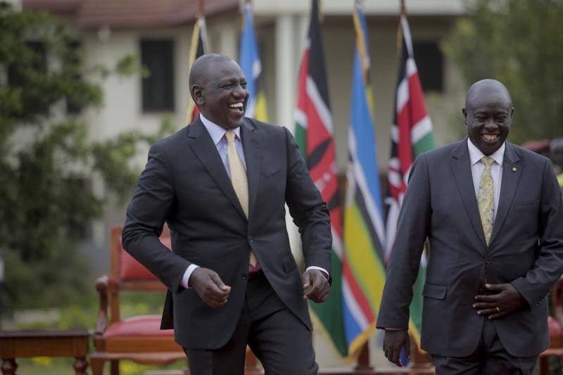 Kenya's President-Elect William Ruto, left, jokes with Deputy President-Elect Rigathi Gachagua, right, as he addresses the media at his official residence in Nairobi, Kenya Monday, Sept. 5, 2022. Kenya's Supreme Court on Monday unanimously rejected challenges to the official results of the presidential election and upheld William Ruto's narrow win in East Africa's most stable democracy. (AP Photo/Brian Inganga)
