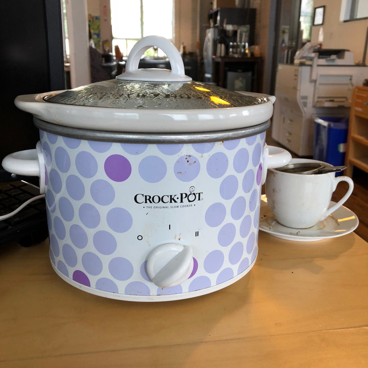 polka-dotted crock pot with a tea cup