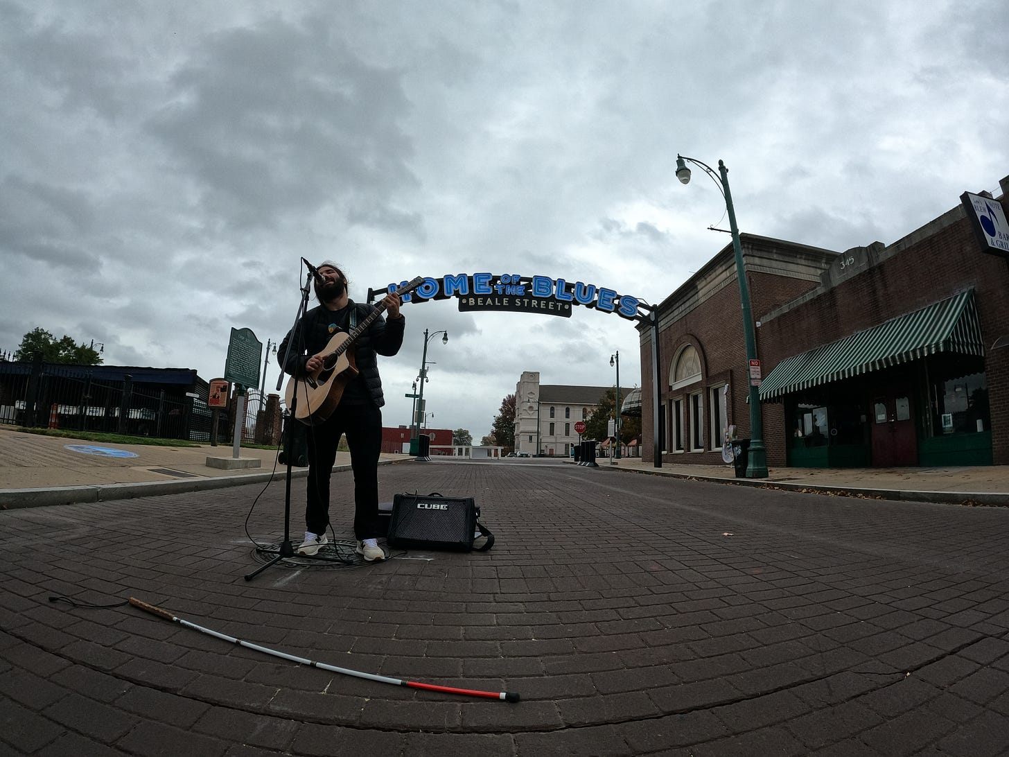 Anthony live streaming in the middle of the road on Beale Street in Memphis, TN